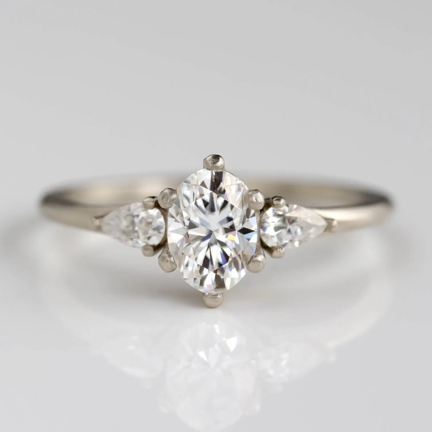 Prong-set Oval Three Stone Ring with Pear-shaped Side Stones