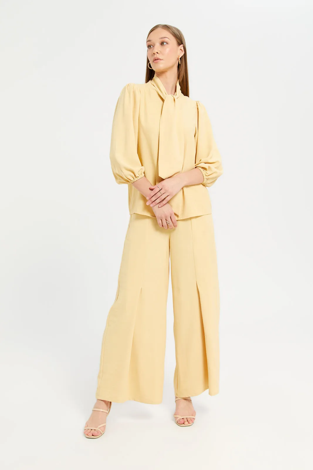 Women Yellow Textured Slit Detailed Trousers